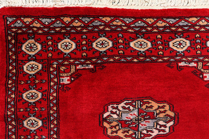 Red Pakistani Bokhara Rug 2' 7" x 9' 9" Hand-Knotted | No. QA20673