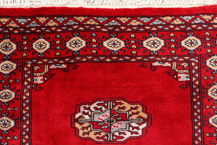 Red Pakistani Bokhara Rug 2' 7" x 9' 9" Hand-Knotted | No. QA20673