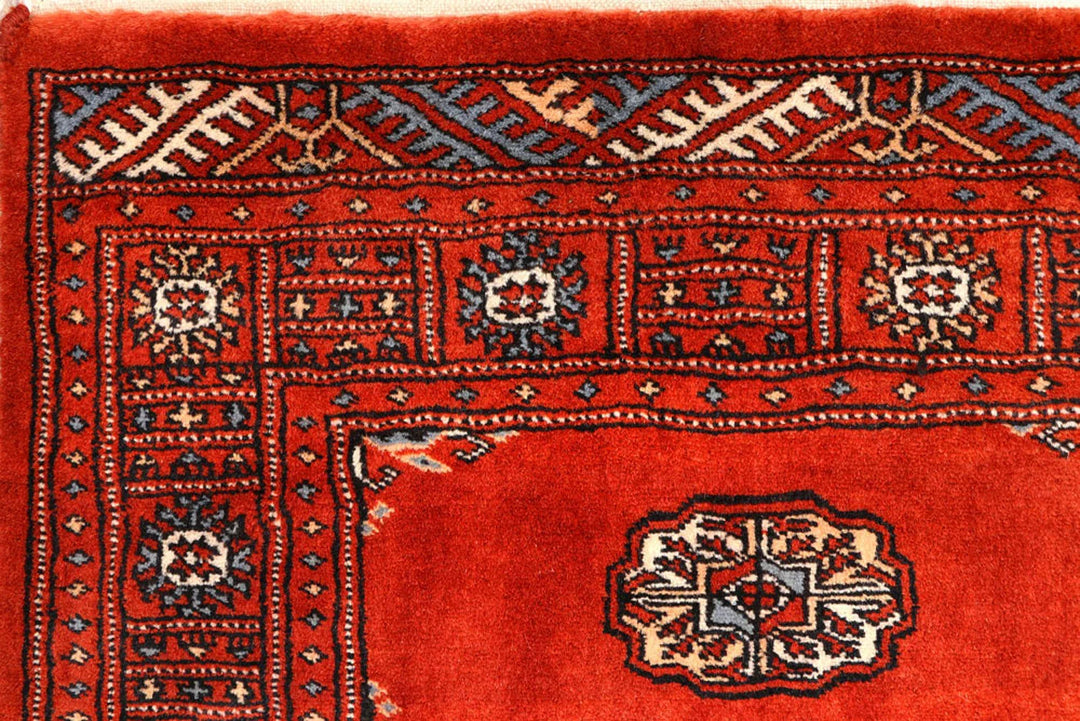 Red Pakistani Bokhara Rug 2' 7" x 10' 3" Hand-Knotted | No. QA20931