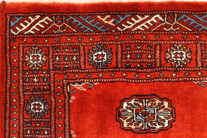 Red Pakistani Bokhara Rug 2' 7" x 10' 3" Hand-Knotted | No. QA20931