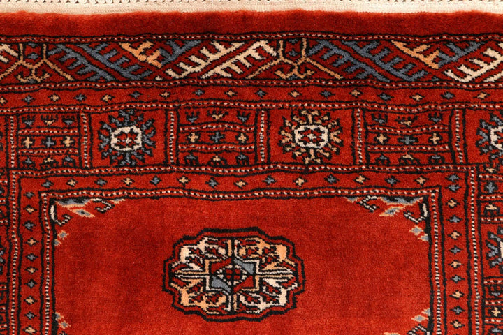 Red Pakistani Bokhara Rug 2' 7" x 10' 3" Hand-Knotted | No. QA20931