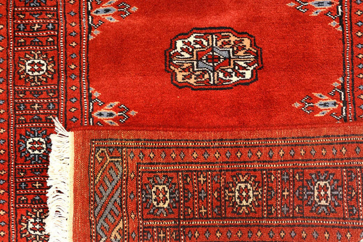 Red Pakistani Bokhara Rug 2' 7" x 10' 3" Hand-Knotted | No. QA20931