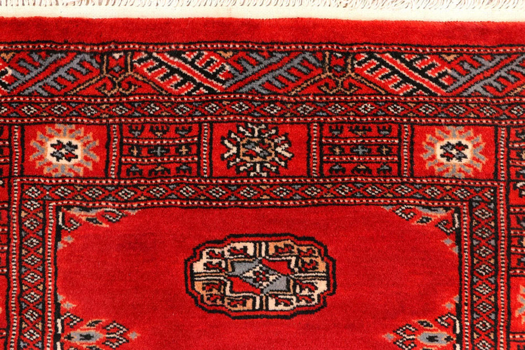 Dark Red Pakistani Bokhara Rug 2' 7" x 10' 9" Hand-Knotted | No. QA21033
