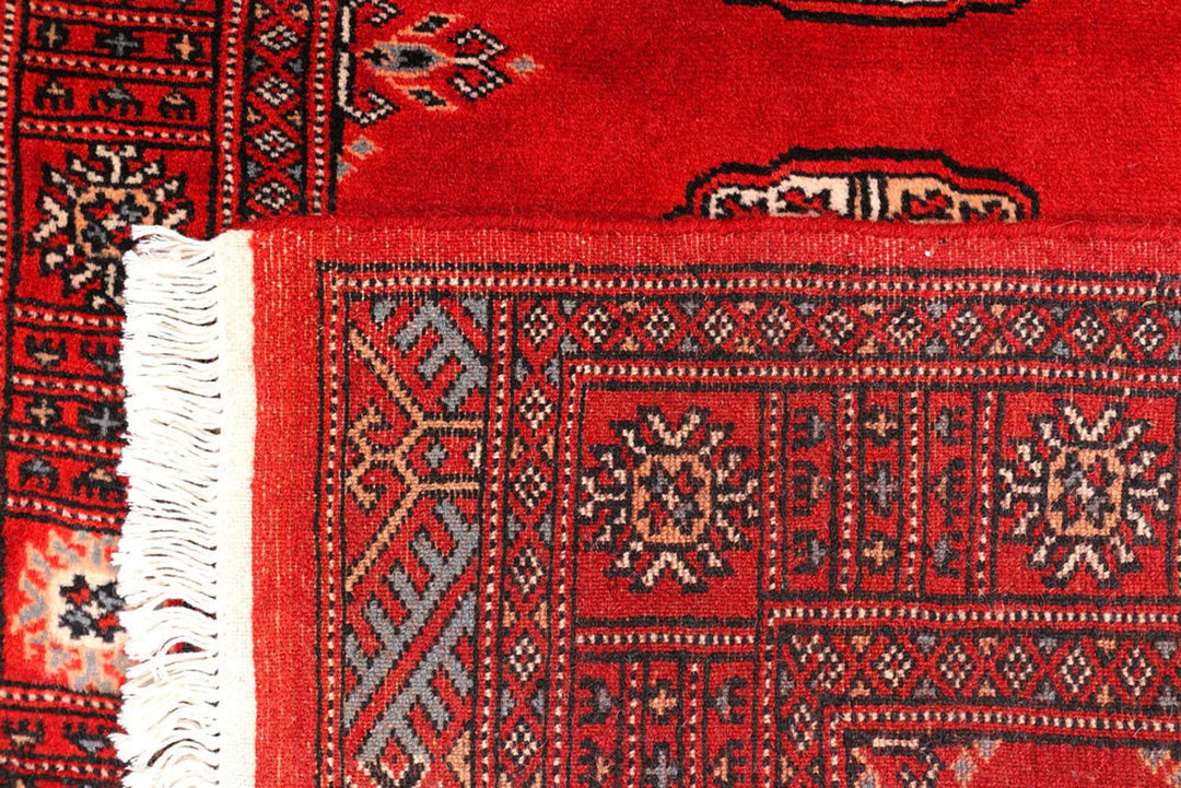 Dark Red Pakistani Bokhara Rug 2' 7" x 10' 9" Hand-Knotted | No. QA21033