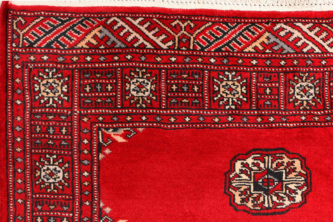 Red Pakistani Bokhara Rug 3' 1" x 5' 7" Hand-Knotted | No. QA21057
