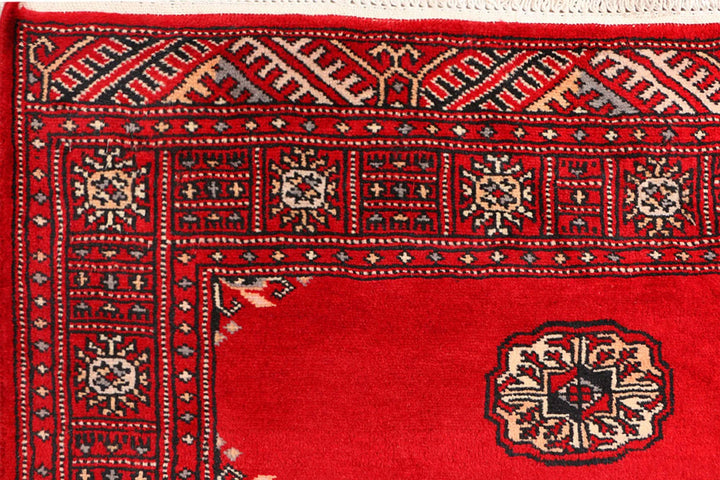 Red Pakistani Bokhara Rug 3' 1" x 5' 7" Hand-Knotted | No. QA21057