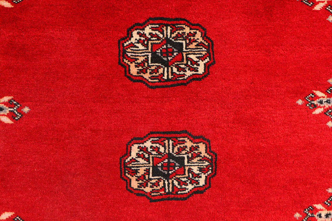Red Pakistani Bokhara Rug 3' 1" x 5' 7" Hand-Knotted | No. QA21057