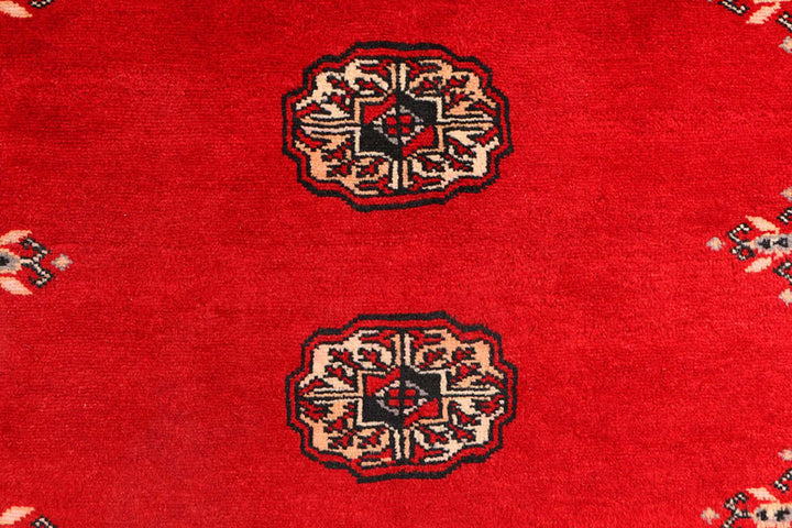 Red Pakistani Bokhara Rug 3' 1" x 5' 7" Hand-Knotted | No. QA21057