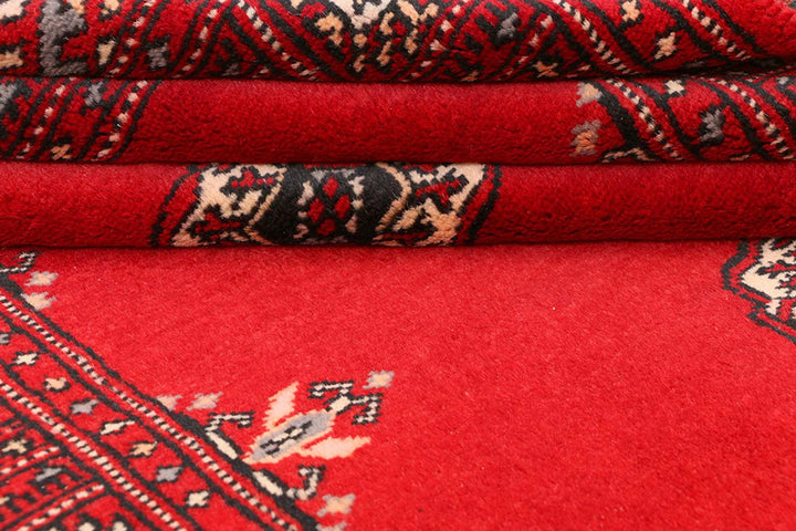 Red Pakistani Bokhara Rug 3' 1" x 5' 7" Hand-Knotted | No. QA21057