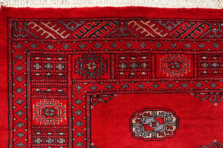 Red Pakistani Bokhara Rug 4' 1" x 6' Hand-Knotted | No. QA21627