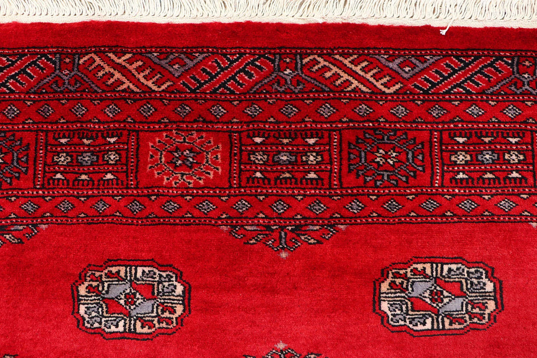Red Pakistani Bokhara Rug 4' 1" x 6' Hand-Knotted | No. QA21627
