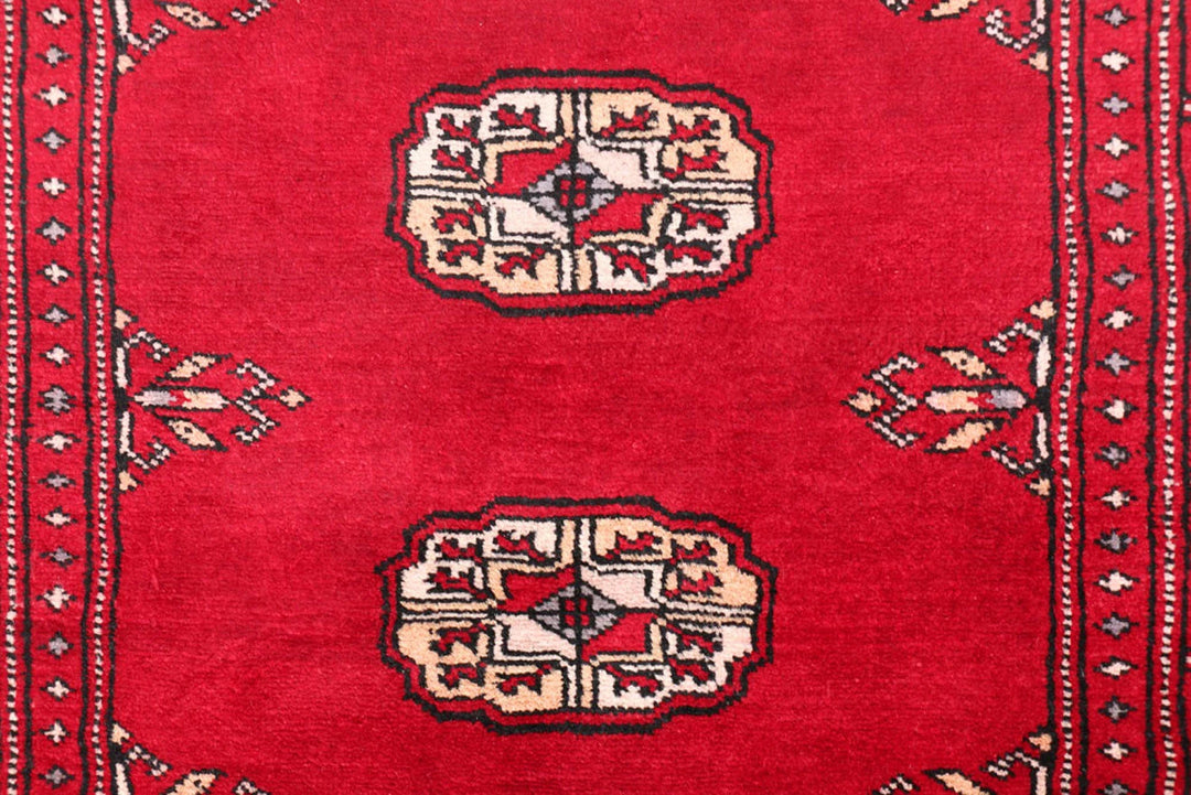 Dark Red Pakistani Bokhara Rug 2' 6" x 10' 6" Hand-Knotted | No. QA21775