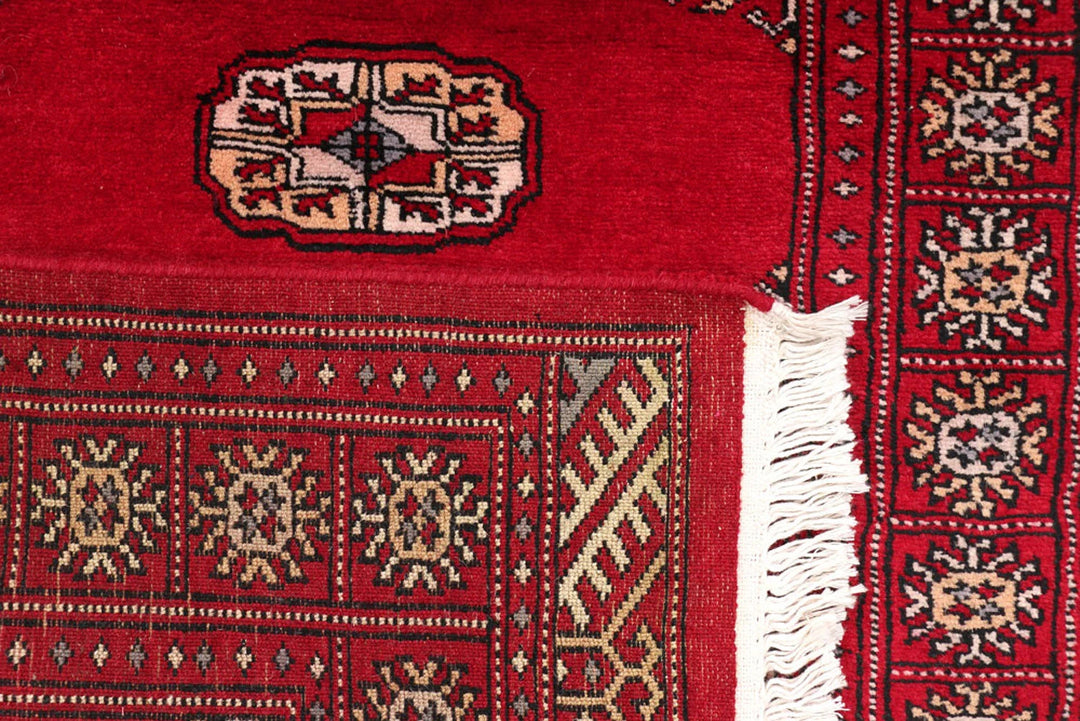 Dark Red Pakistani Bokhara Rug 2' 6" x 10' 6" Hand-Knotted | No. QA21775