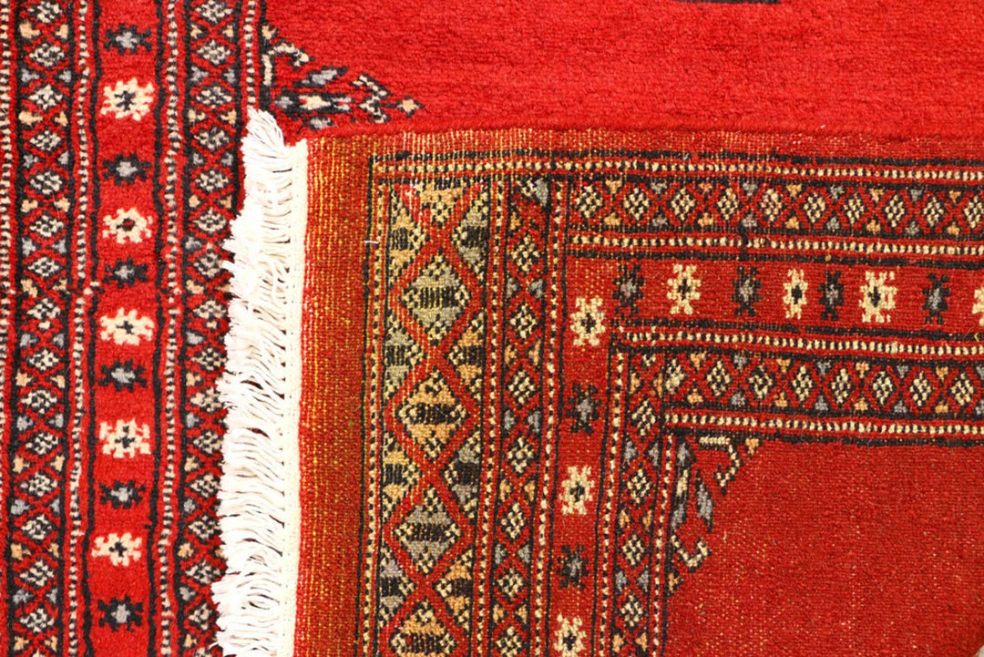 Red Pakistani Bokhara Rug 2' 7" x 8' 8" Hand-Knotted | No. QA22687