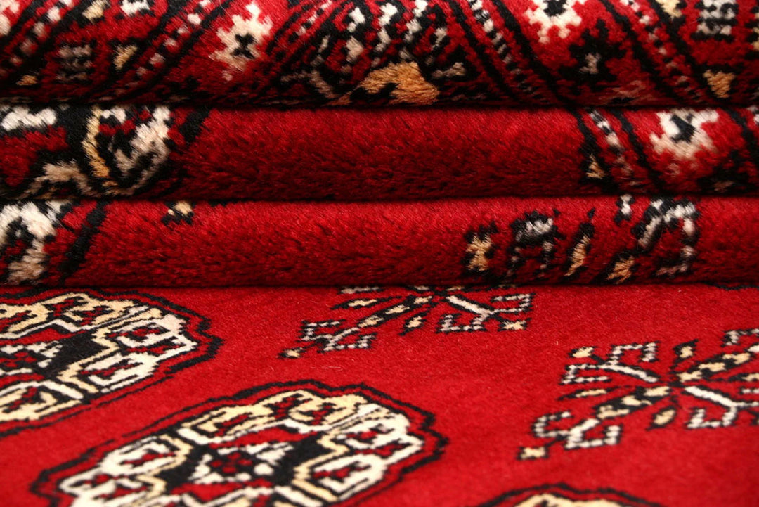 Red Pakistani Bokhara Rug 8' x 10'4" Hand-Knotted | No. QA22750