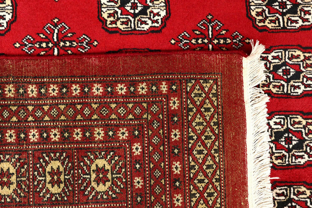 Red Pakistani Bokhara Rug 8' x 10'4" Hand-Knotted | No. QA22750