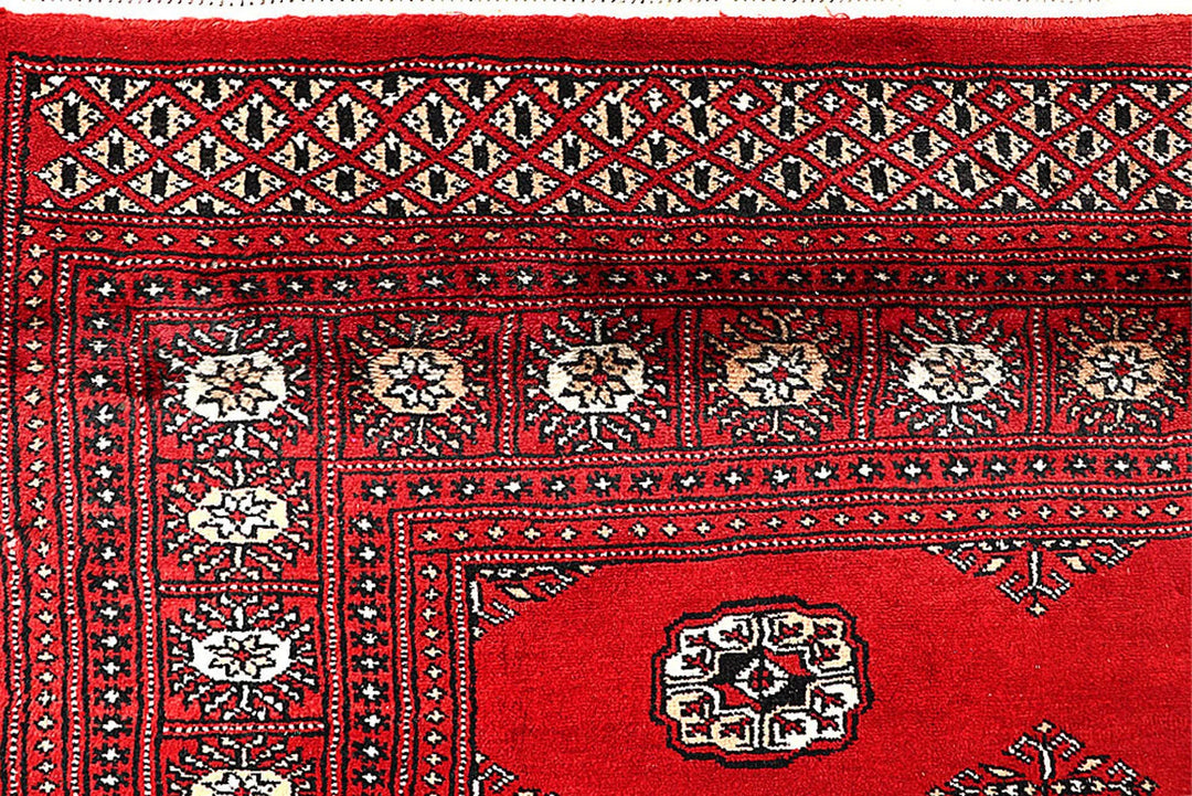 Red Pakistani Bokhara Rug 5' 7" x 9' Hand-Knotted | No. QA22948
