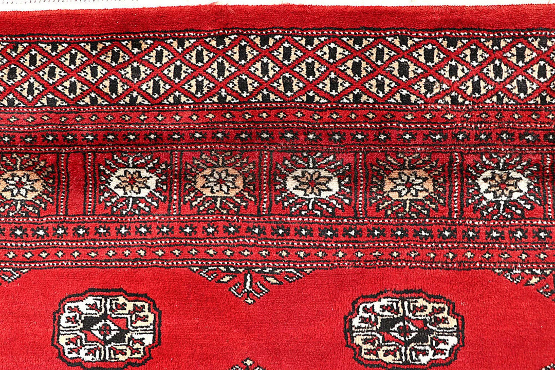 Red Pakistani Bokhara Rug 5' 7" x 9' Hand-Knotted | No. QA22948