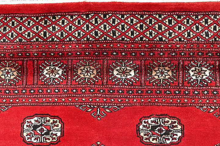Red Pakistani Bokhara Rug 5' 7" x 9' Hand-Knotted | No. QA22948