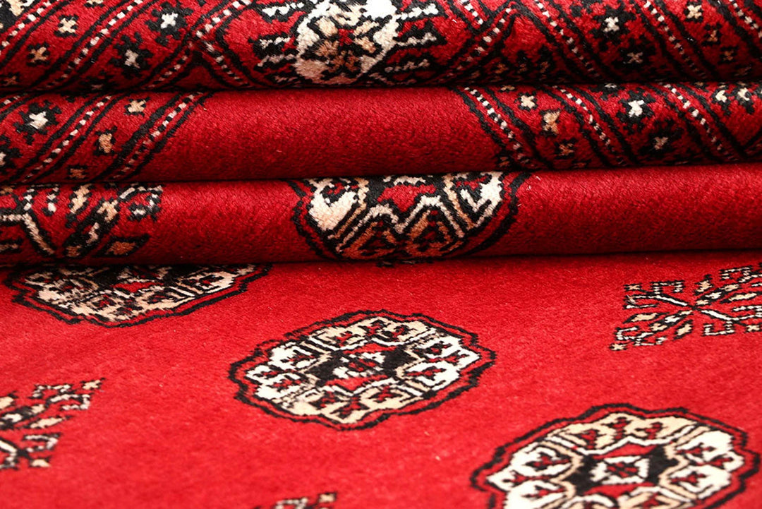 Red Pakistani Bokhara Rug 5' 7" x 9' Hand-Knotted | No. QA22948