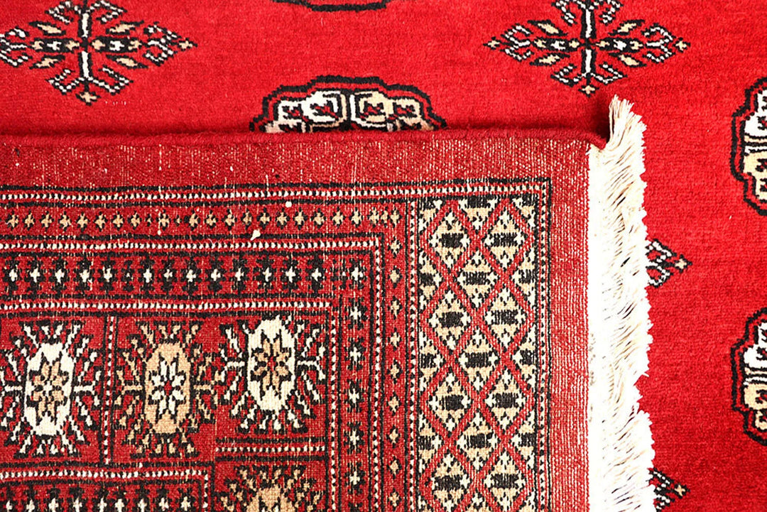 Red Pakistani Bokhara Rug 5' 7" x 9' Hand-Knotted | No. QA22948