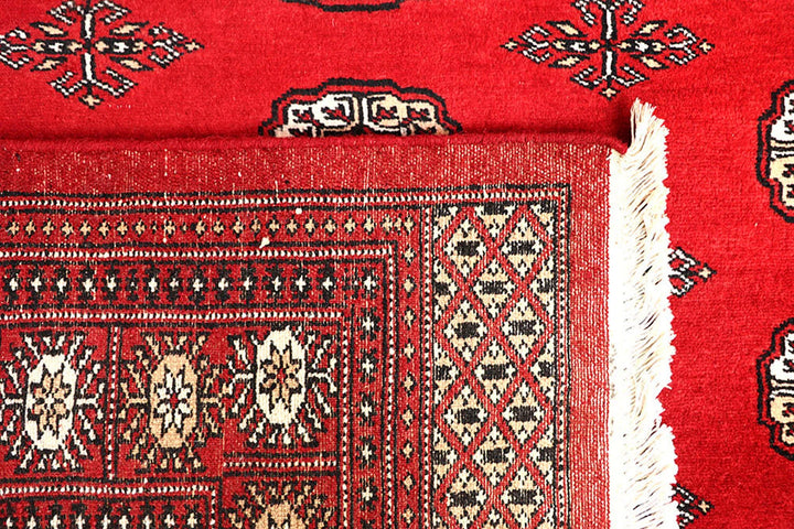 Red Pakistani Bokhara Rug 5' 7" x 9' Hand-Knotted | No. QA22948