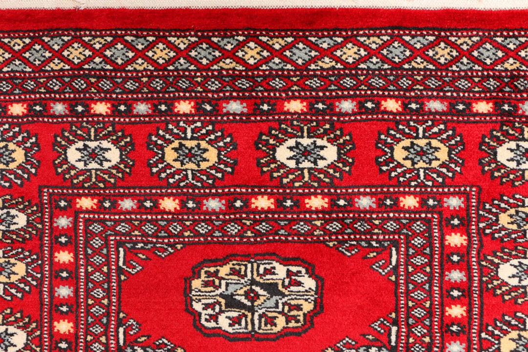 Red Pakistani Bokhara Rug 3' 1" x 5' 7" Hand-Knotted | No. QA23324