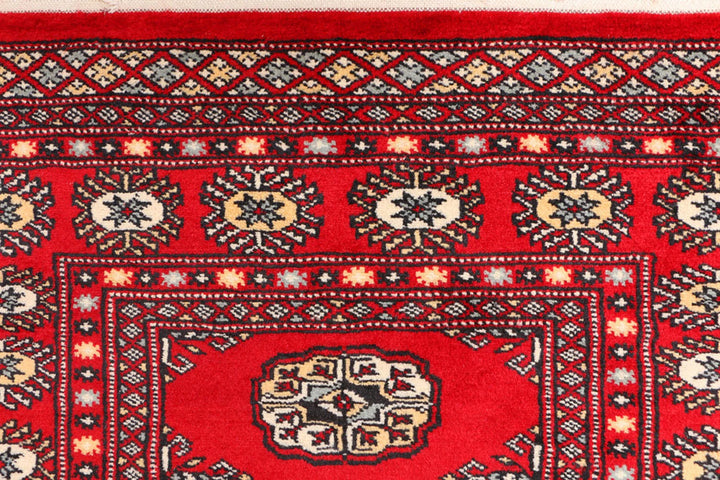 Red Pakistani Bokhara Rug 3' 1" x 5' 7" Hand-Knotted | No. QA23324