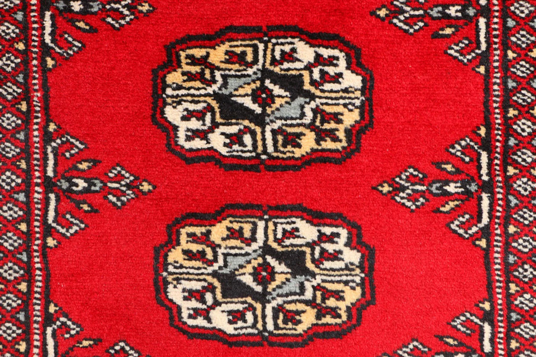 Red Pakistani Bokhara Rug 3' 1" x 5' 7" Hand-Knotted | No. QA23324
