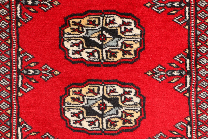 Red Pakistani Bokhara Rug 3' 1" x 5' 7" Hand-Knotted | No. QA23324