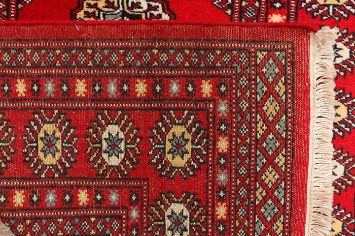 Red Pakistani Bokhara Rug 3' 1" x 5' 7" Hand-Knotted | No. QA23324