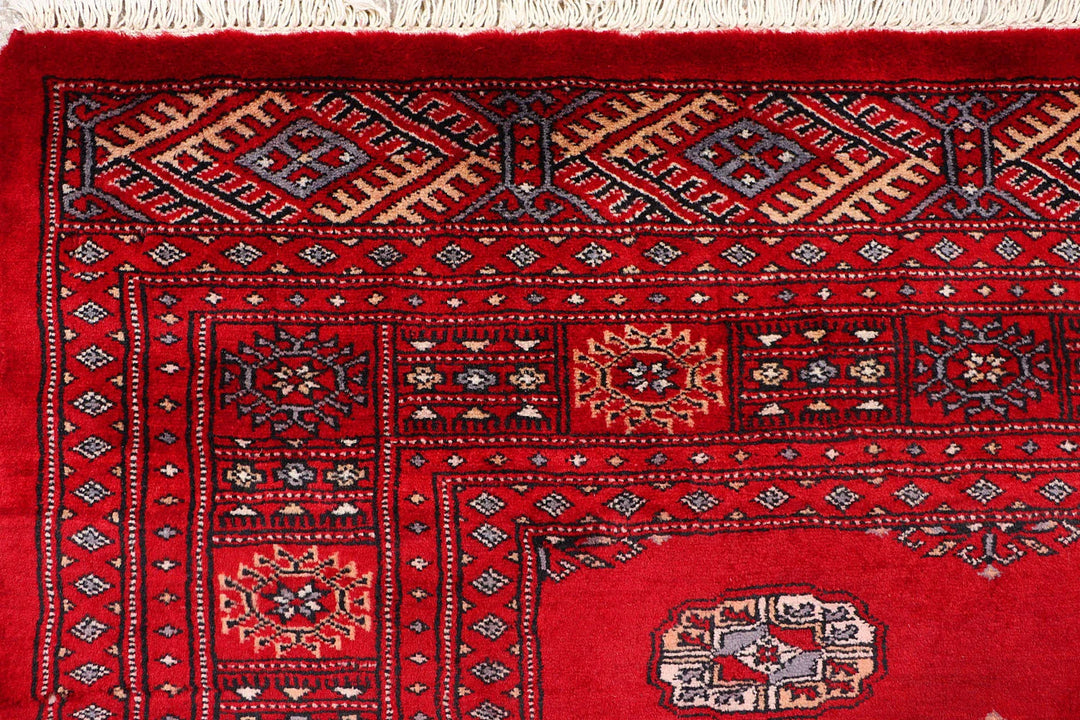 Red Pakistani Bokhara Rug 4' 1" x 6' 5" Hand-Knotted | No. QA23603