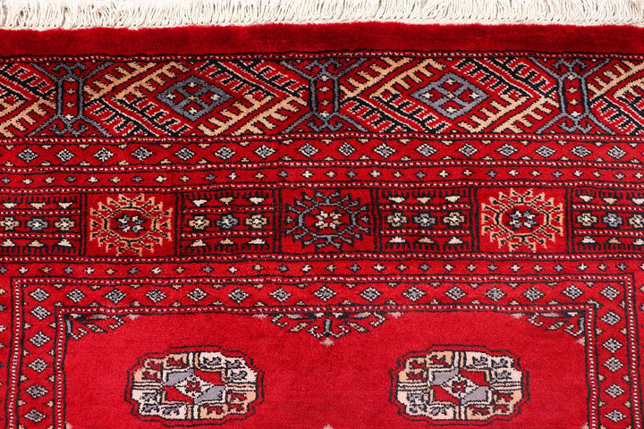 Red Pakistani Bokhara Rug 4' 1" x 6' 5" Hand-Knotted | No. QA23603