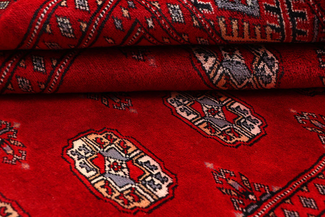 Red Pakistani Bokhara Rug 4' 1" x 6' 5" Hand-Knotted | No. QA23603