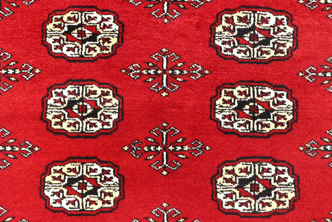 Red Pakistani Bokhara Rug 6' x 9' Hand-Knotted | No. QA24811
