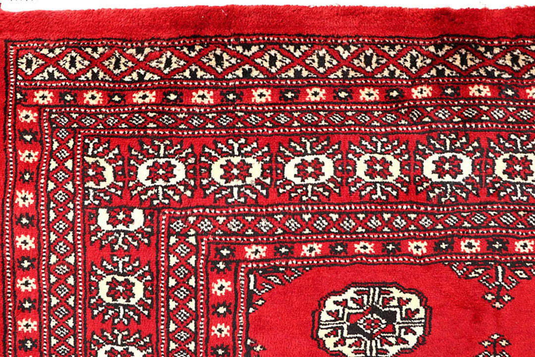 Red Pakistani Bokhara Rug 4' 2" x 6' 6" Hand-Knotted | No. QA25015