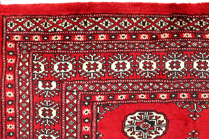 Red Pakistani Bokhara Rug 4' 2" x 6' 6" Hand-Knotted | No. QA25015