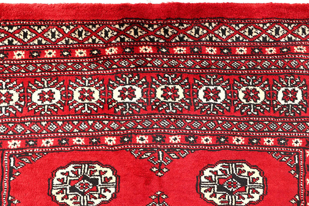 Red Pakistani Bokhara Rug 4' 2" x 6' 6" Hand-Knotted | No. QA25015