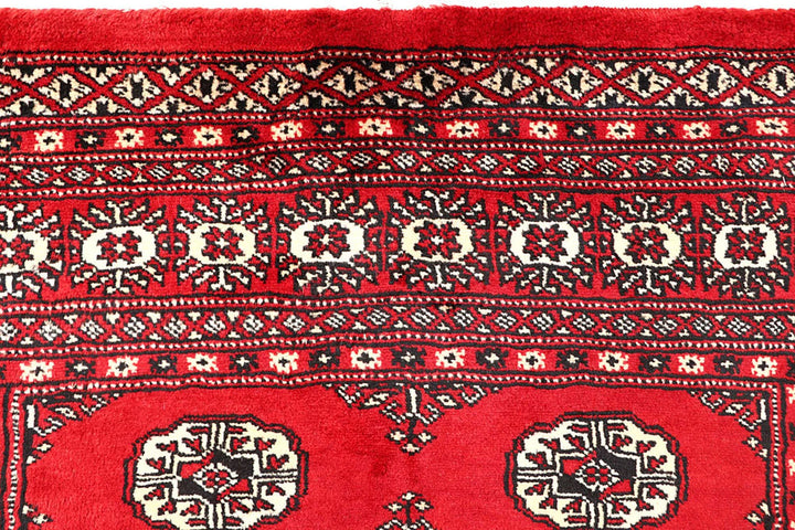 Red Pakistani Bokhara Rug 4' 2" x 6' 6" Hand-Knotted | No. QA25015