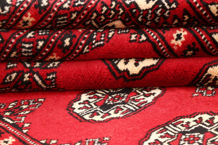 Red Pakistani Bokhara Rug 4' 2" x 6' 6" Hand-Knotted | No. QA25015