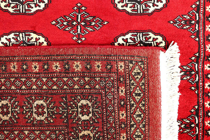 Red Pakistani Bokhara Rug 4' 2" x 6' 6" Hand-Knotted | No. QA25015
