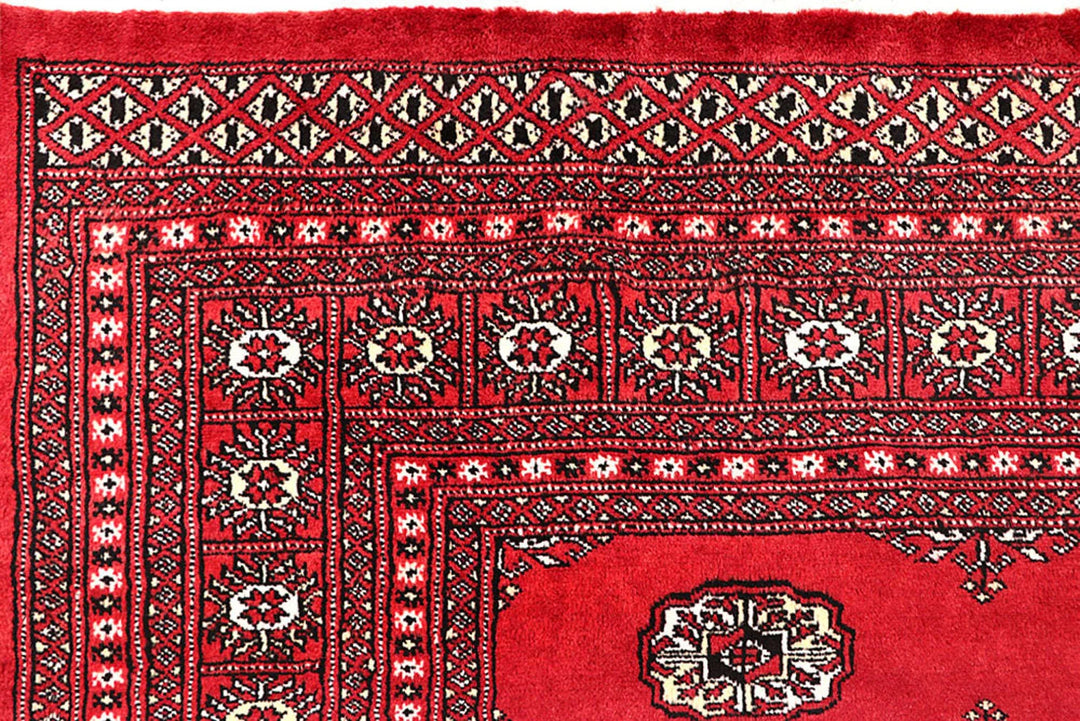 Crimson Pakistani Bokhara Rug 6' 1" x 9' 1" Hand-Knotted | No. QA26803