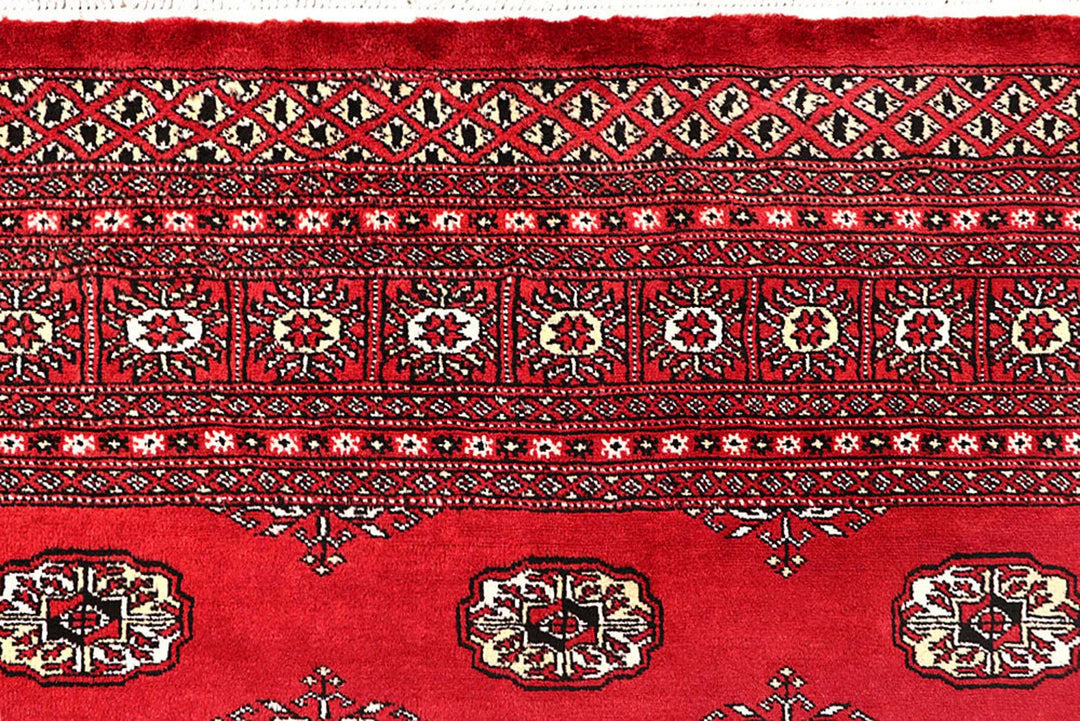 Crimson Pakistani Bokhara Rug 6' 1" x 9' 1" Hand-Knotted | No. QA26803