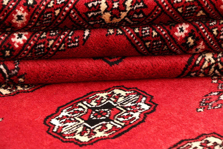 Crimson Pakistani Bokhara Rug 6' 1" x 9' 1" Hand-Knotted | No. QA26803