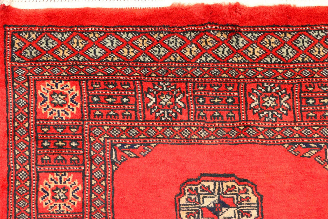 Red Pakistani Bokhara Rug 2' 7" x 11' 2" Hand-Knotted | No. QA27241