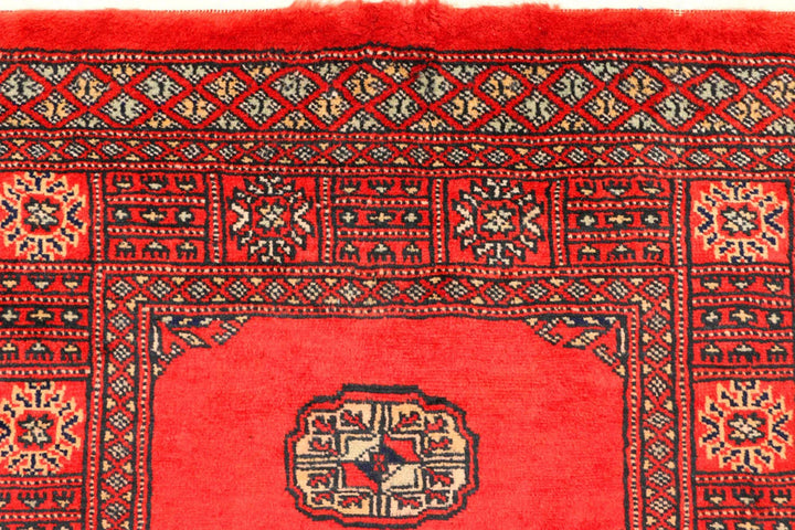 Red Pakistani Bokhara Rug 2' 7" x 11' 2" Hand-Knotted | No. QA27241