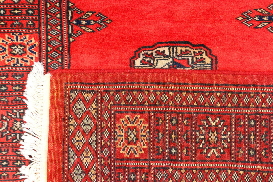 Red Pakistani Bokhara Rug 2' 7" x 11' 2" Hand-Knotted | No. QA27241