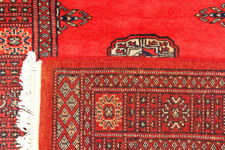Red Pakistani Bokhara Rug 2' 7" x 11' 2" Hand-Knotted | No. QA27241