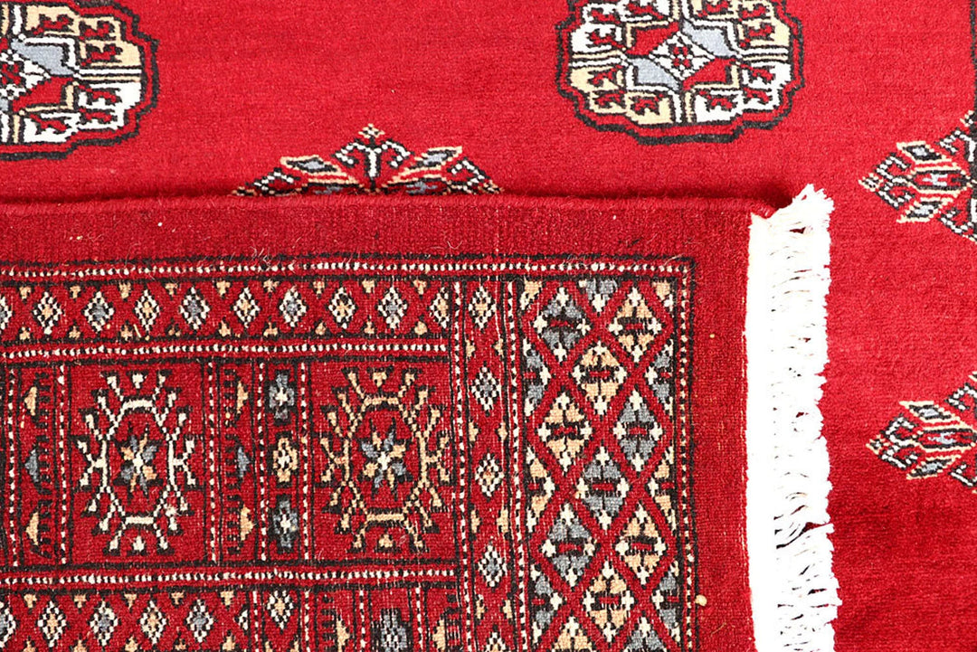 Red Pakistani Bokhara Rug 4' x 6'2" Hand-Knotted | No. QA27568