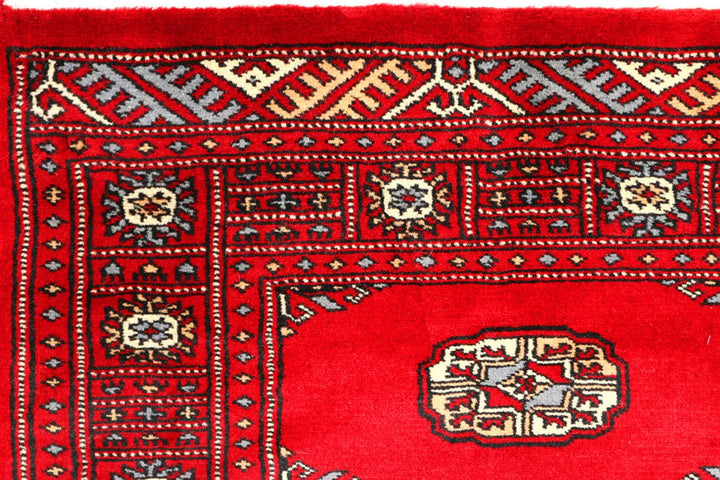 Red Pakistani Bokhara Rug 2' 7" x 8' 11" Hand-Knotted | No. QA27636